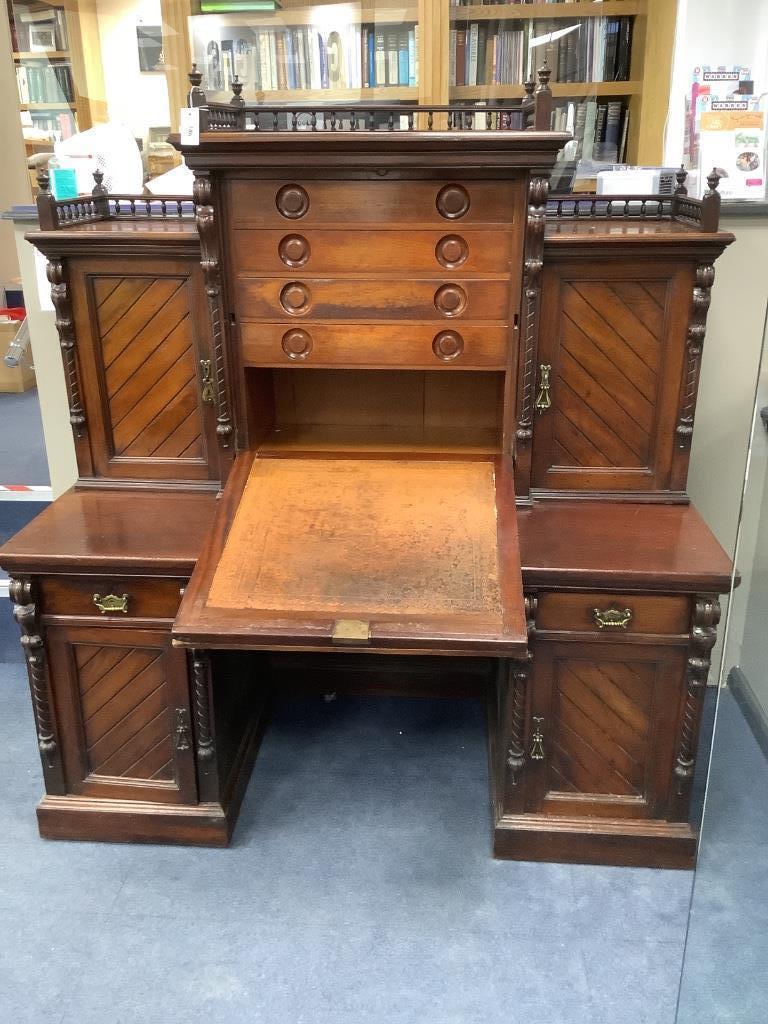 A late Victorian mahogany kneehole desk with fall front, width 151cm, depth 74cm, height 174cm